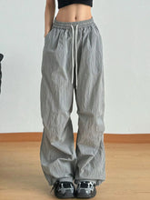 Gray wide leg drawstring casual pants with loose fit and subtle vertical pleats for comfortable everyday wear