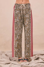 Bi bi leopard print pants with red and white striped side panels and tucking welt pockets in leopard print