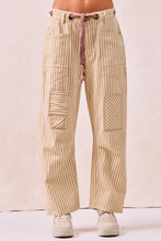 Beige and cream vertical striped twill barrel pants with a muted pinkish drawstring waistband by bibi