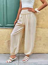 Cream-colored ruched high waist joggers with soft flowing fabric high waist and elastic cuffs for comfort