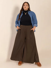 Brown plus size wide leg pants with high waist pleated front and functional pockets for comfortable wear