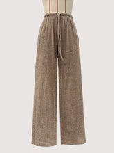 Beige ribbed knit wide leg pants with a drawstring waistband designed for comfortable casual wear