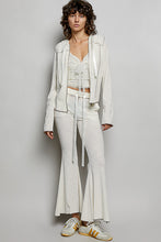 White textured ribbed knit flared pants with drawstring waistband from POL drawstring textured ribbed knit collection