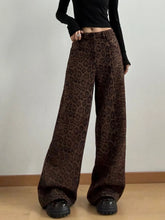 Brown leopard print wide leg high waist pants featuring a flowing silhouette and bold animal pattern
