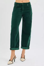 Dark green high rise crop barrel corduroy pants with rolled cuffs offering stylish and comfortable wear