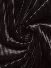 Black velvet high-waisted wide-leg pants with soft plush texture and subtle vertical ribbing for elegant wear