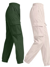 Dark green and beige cargo pants with elastic waistbands large side pockets and drawstring cuffs in a 2 piece elastic waist set
