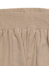 Beige pleated fabric smocked waist wide leg pants with elastic smocked waist for comfortable fit