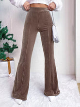 Brown corduroy high waist flare pants with ribbed texture and a high waist design for a stylish fit