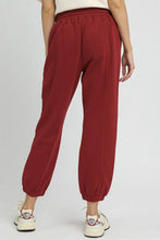 Umgee fleece jogger pants in red with a drawstring waist allows adjustable fit and cuffed ankles for comfort