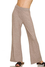Brown shimmering flare pants with soft textured fabric and elastic waisted flare design by zenana
