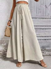 Beige high-waisted wide leg casual pants with an elastic drawstring waist for comfortable everyday wear