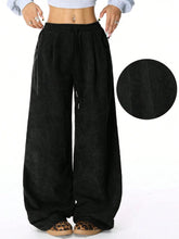 Black corduroy wide-leg pants with elastic waistband and drawstring suitable for machine wash care instructions