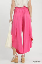 Bright pink Umgee flowy asymmetrical hem wide leg pants with ruched waistband and high-waisted design