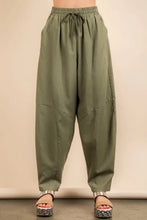 Olive green high-waisted solid barrel comfy woven pants with a relaxed wide-leg cut and subtle paneling