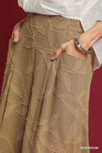 Umgee jacquard wide-leg pants in tan with a textured leaf pattern woven into the fabric