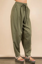 Olive green solid barrel comfy high-waisted woven pants with drawstring and relaxed tapered fit