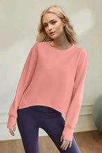 Woman in Basic Bae Air Scuba round neck long sleeve salmon pink sweatshirt