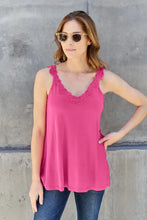 A vibrant pink basic bae cutout cami with delicate lace trim along the v-neckline and sleeveless straps