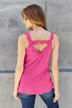 A vibrant pink basic bae sleeveless cutout cami with delicate lace trim along the straps and a back cutout detail