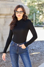 Basic bae full size mock neck long sleeve black bodysuit on a regular size model-height showcasing sleek fit