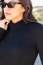 Black basic bae full size mock neck long sleeve bodysuit made of smooth form-fitting fabric on regular size model-height