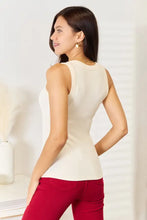 Cream-colored sleeveless basic bae tank top with fitted silhouette and round neckline perfect for jeans size styling