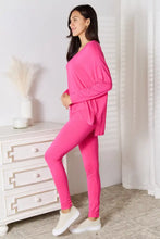 Bright pink soft rayon basic bae pants lounge set with long sleeve v-neck top and matching leggings with asymmetrical hemline