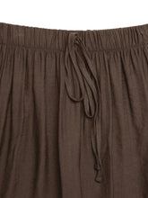 Brown casual wide-leg pants made of softly wrinkled fabric with elastic waistband and matching drawstring care instructions included