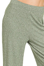 A pair of olive green heathered zenana soft elastic waisted flare pants made from soft stretchy fabric with elastic waistband