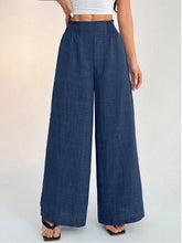 Navy blue elastic waist wide leg pants in textured fabric designed for comfortable daily wear