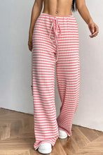 Ribbed knit drawstring wide leg pants featuring pink and white checkered pattern with a comfortable drawstring waist