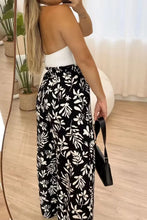 Full size printed high waist wide leg pants featuring black and white floral print for stylish comfort