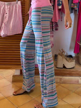 Drawstring striped pants featuring wide-leg design with vibrant blue pink and teal horizontal stripes for comfortable wear