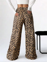 Beige leopard print wide leg plush pants made of soft flowing fabric for comfortable stylish wear