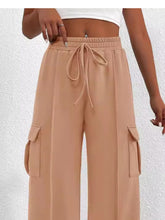 Beige casual high waist cargo pants with wide-leg design elastic waistband and matching drawstring