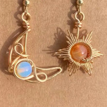 Asymmetrical beaded alloy earrings with gold wire-wrapped sun and moon design