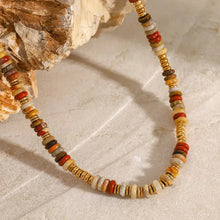 Multicolored beaded choker necklace with natural stone, earthy tones, and 18k gold-plated accents