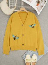 Bee embroidered yellow knit cardigan, back view at shoulder seam