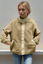 Beige oversized fleece jacket with cream collar, pockets in every size