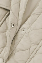 Light gray quilted puffer vest with high collar, pockets, silver buttons and trim