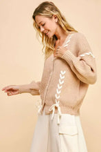 Beige chunky knit cardigan with lace-up ribbon bow details