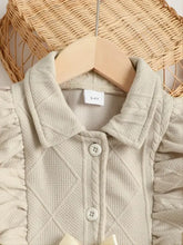 Beige collared neck dress with ruffled bow and quilted cardigan sleeves