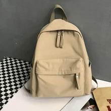 Beige cotton backpack bag with multiple zippered compartments