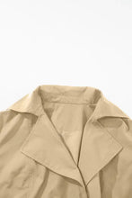 Beige double-breasted trench coat with adjustable belt