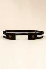 Beige elastic snap closure belt with black faux leather ends and striped metal buckles