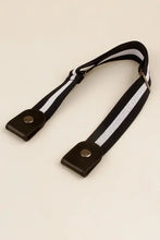 Beige elastic snap closure belt with black and white reflective strap handle