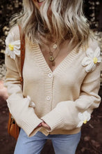 Beige floral cardigan sweater with white and yellow flowers, button closure