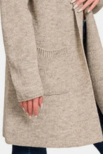 Beige hooded open sweater cardigan with pockets and fur trim