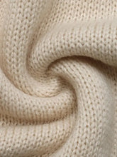 Cream-colored textured knitted sweater with balloon sleeves and lace-up detail